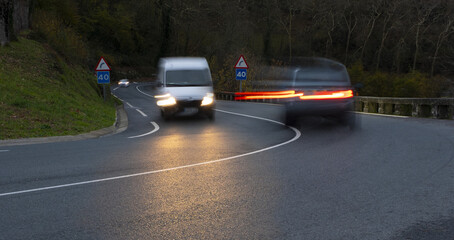 Obraz premium curvy road and car lights