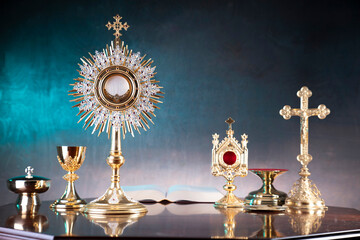 Religion concept. Catholic symbols composition: monstrance, The Cross, Holy Bible, rosary and...