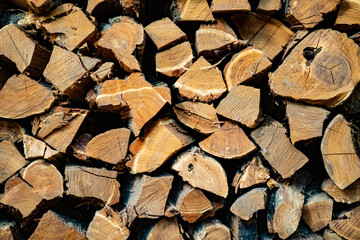 background. firewood for the fireplace stacked on top of each other. 