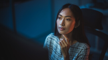 Portrait of a Financial Analyst Working on Computer with Multi-Monitor Workstation with Real-Time...