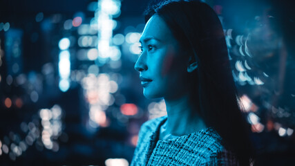 Beautiful Asian Female Portrait Standing on City Street with Neon Lights Late in the Evening....