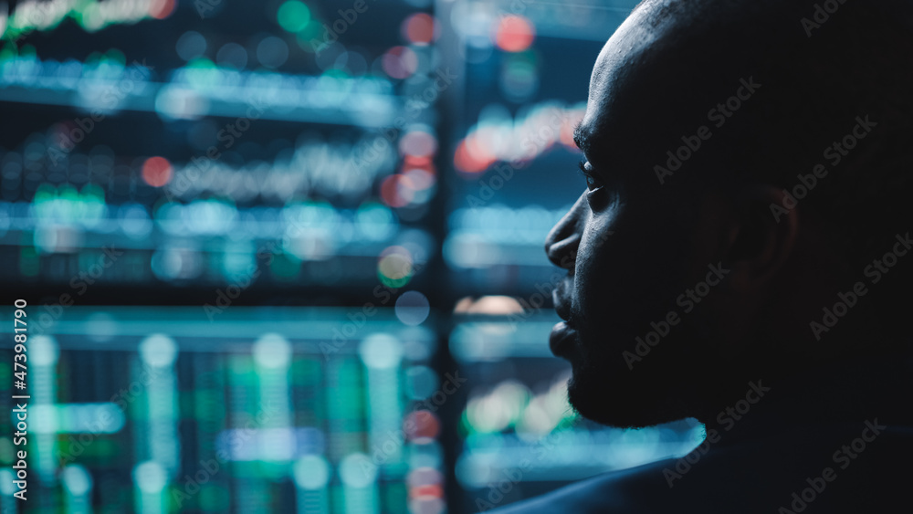Poster close up portrait of financial analyst working on computer with multi-monitor workstation with real-