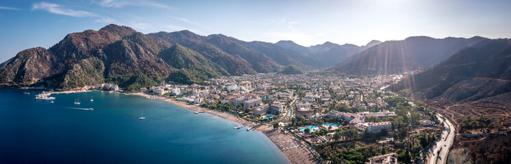 Panorama of the Turkish city of Icmeler. Aerial view of the bay, city beach and mountains