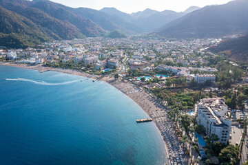 Panorama of the Turkish city of Icmeler. Aerial view of the bay, city beach and mountains