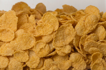 pile of cereal corn flakes background close up filled frame copy space wallpaper shot