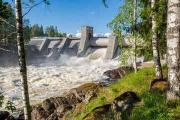 View of The Imatrankoski rapid (The Imatra Rapid) and the hydroelectric powerplant dam in summer,...