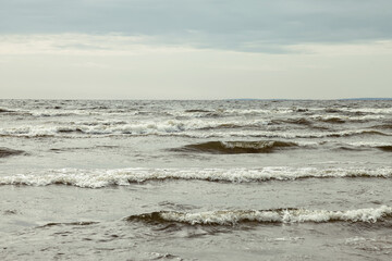 Atmospheric scenery Dramatic Baltic sea, waves and water splashes on breakwaters