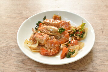 spicy stir fried river shrimp with fresh pepper  and finger root on plate