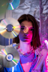 Cinematic night portrait of girl and neon lights. Fashion. Woman in Colorful neon light. girl in disco, makeup dance. Party disco neon nightclub vibes. creative art neon pink blue light.