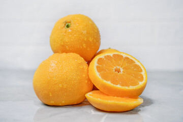 ripe tangerines on a light background. Close-up. Horizontal photo.
