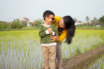 Asian mothers and children are joking