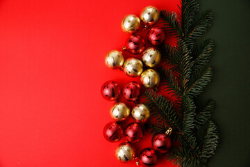 Fototapeta na wymiar Christmas composition. Christmas red decorations, fir tree branches on red background. Flat lay, top view, copy space