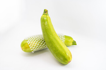 Fresh zucchini on pure white background