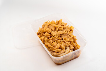 Spicy tofu skin lotus root slices on pure white background