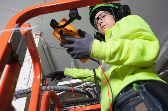 Engineer working with multimeter