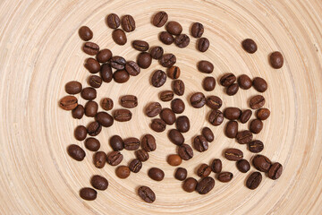 Coffee beans on a wooden background.