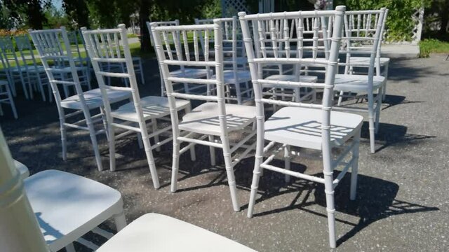White ceremony wooden chairs. Wedding detail. Before party set. Luxury park reception. Graduation backyard. Elegant archway