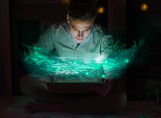 Male professional using laptop with computer graphics