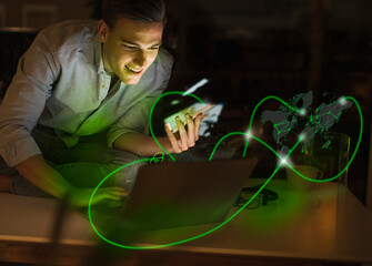 Businessman using wireless technologies surrounded by computer network
