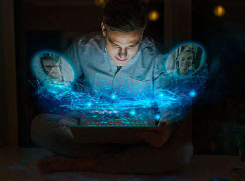 Businessman doing video call on laptop with colleagues at home office