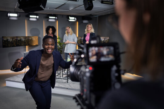 TV show host and guests in studio