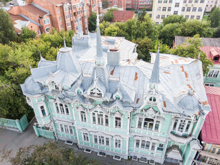 Aerial view of wooden house with carved windows of architector Homich, Tomsk architecture monument. Siberia, Russia