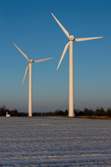 wind farms on a blue sky background on a sunny winter day in december