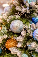 Christmas background-colored toys hang on the Christmas tree
