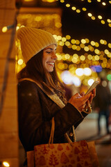 Woman on Christmas time using the phone