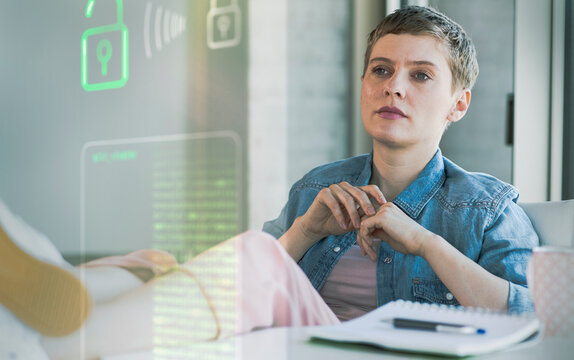 Businesswoman looking at data security system at office