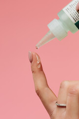 a drop falls on a finger
