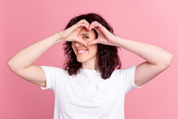 Photo of young pretty girl show fingres heart figure look valentine day isolated over pink color background