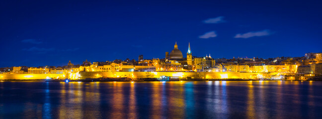 Coastline of Malta and the architecture of Valletta city at night