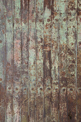 Abstract green painted and rusted metal door 