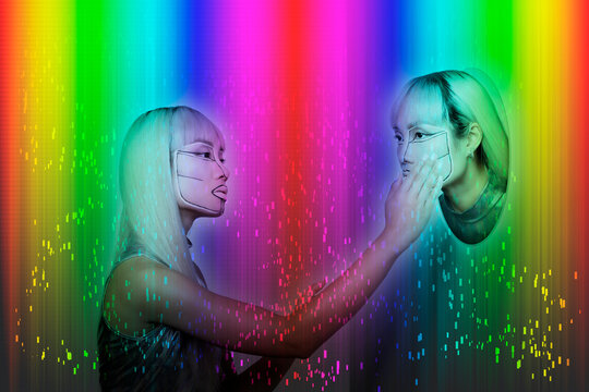 Young woman touching female robot on colored background