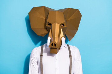 Photo of serious confident man wear weird elephant mask white shirt isolated blue color background