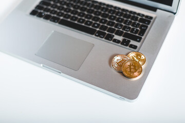 Golden Coins on a laptop keyboard. Cryptocurrency