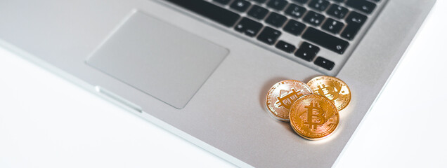 Golden Coins on a laptop keyboard. Cryptocurrency