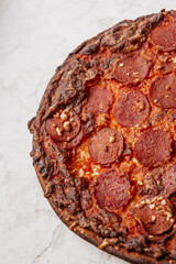 pepperoni pizza on marble counter