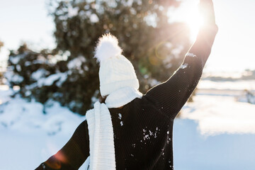 Woman in warm clothing enjoying winter