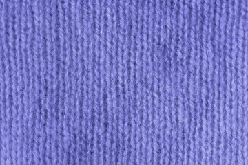 Trendy Color of Year Very peri. texture of knitted angora fabric. Violet wool texture. Knitted jersey background with relief pattern for wallpaper and abstract background. Wool hand- machine, handmade