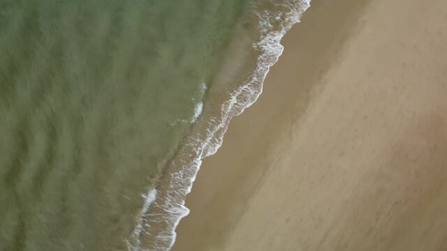 Flyng drone above coastal line on sunny Cyprus island in Mediterranian sea