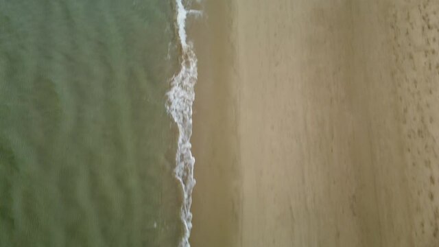 Flyng drone above coastal line on sunny Cyprus island in Mediterranian sea