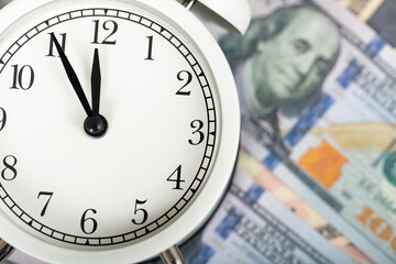 dollars and alarm clock. money and economy concept.
