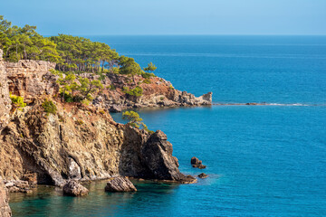 Fototapeta na wymiar Mediterranean seascape with steep wooded coast