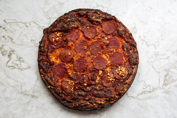 pepperoni pizza on marble counter