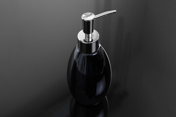 stylish antiseptic dispenser on a dark background