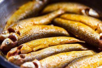 Marinated Indian Raw Fish. Bengali raw mullet fish or parshe mach marinated with turmeric, salt and various spices in a bowl ready for cooking. Background for regional food, cover, sea food cuisine.