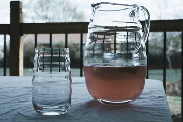 Close up of Pink lemonade in pitcher on table