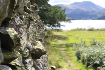 Fototapeta na wymiar Stone wall near the lake